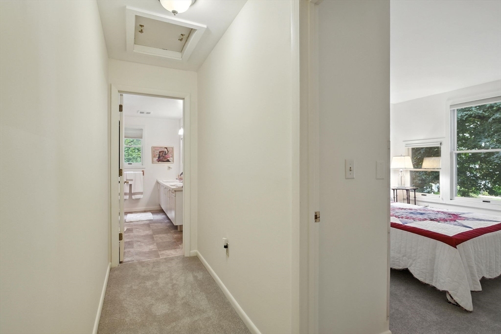 5 Amity Place, Unit 5 Amherst, MA 01002 - Photo 23 of 39 a bedroom with a bed and a view of bathroom