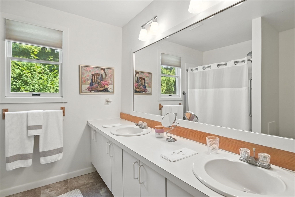 5 Amity Place, Unit 5 Amherst, MA 01002 - Photo 27 of 39 a bathroom with a sink double vanity and a mirror