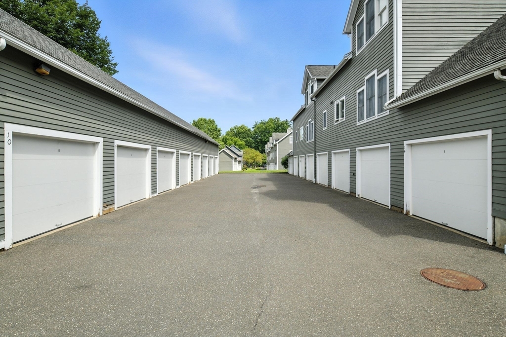 5 Amity Place, Unit 5 Amherst, MA 01002 - Photo 32 of 39 a view of a house with backyard and parking
