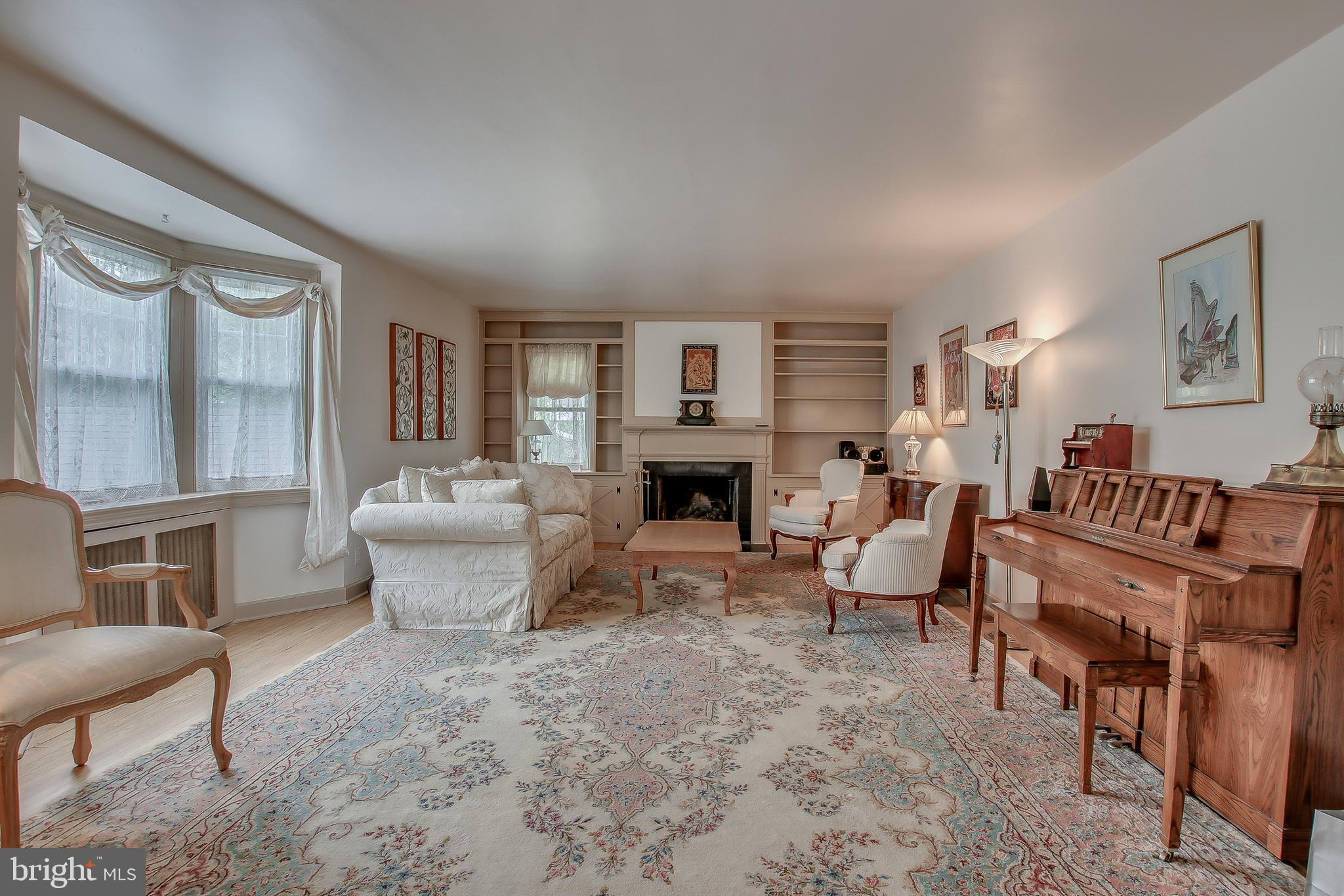 Living Room with built-ins & fireplace