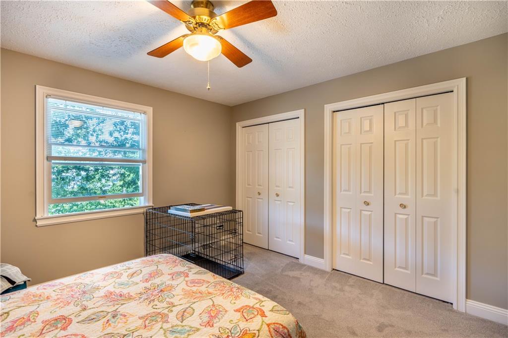 228 Country View Drive Lower Burrell, PA 15068 - Photo 24 of 49 a bedroom with a bed and a chandelier