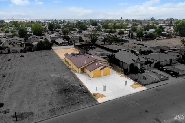 an aerial view of a house with a garden