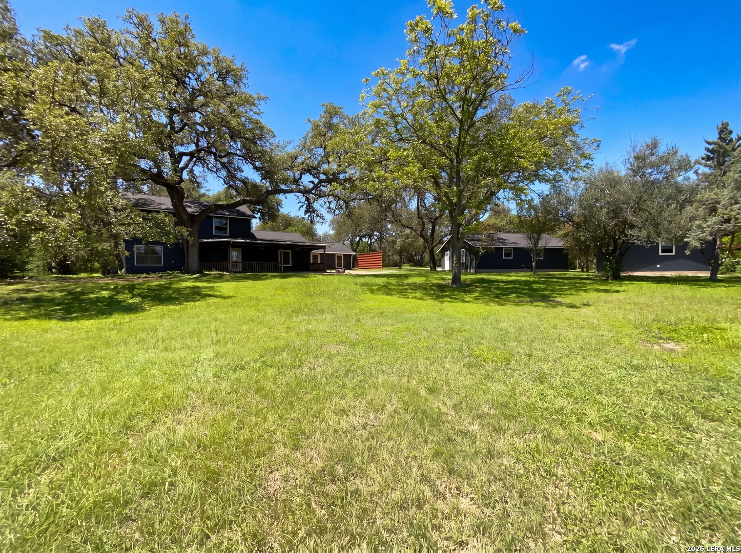 15422 Geronimo Loop San Antonio, TX 78254 - Photo 5 of 21 a view of a swimming pool with an outdoor space and seating area