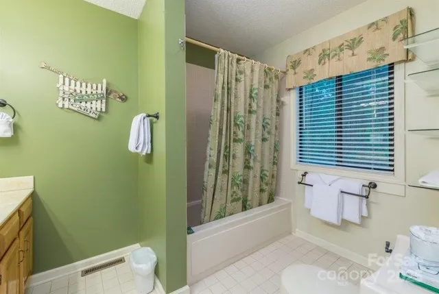 a bathroom with a sink a toilet and tub