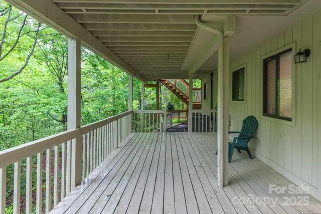 a view of a balcony with wooden floor