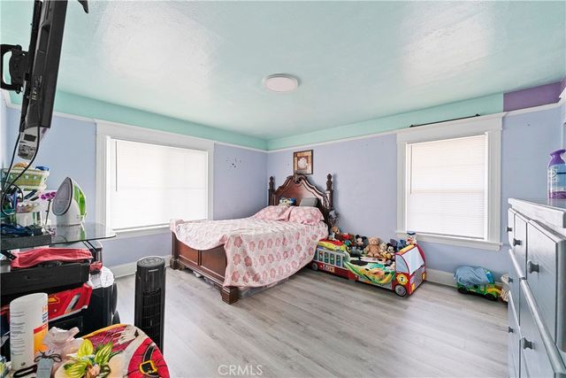 a bedroom with bed and a window