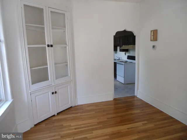 a view of a kitchen from the hallway