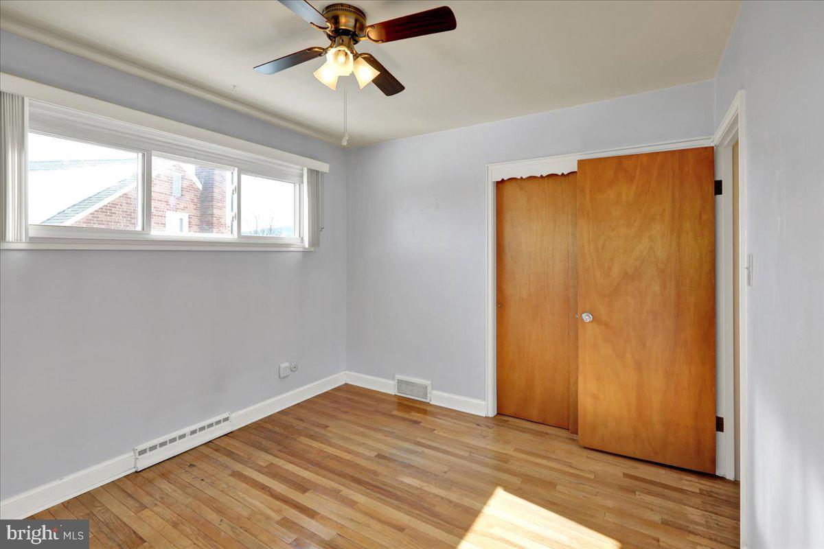 629 Lawrence Avenue Reading, PA 19609 - Photo 14 of 39 a view of empty room with wooden floor and fan