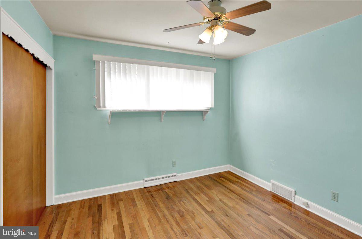 629 Lawrence Avenue Reading, PA 19609 - Photo 15 of 39 wooden floor in an empty room with a window