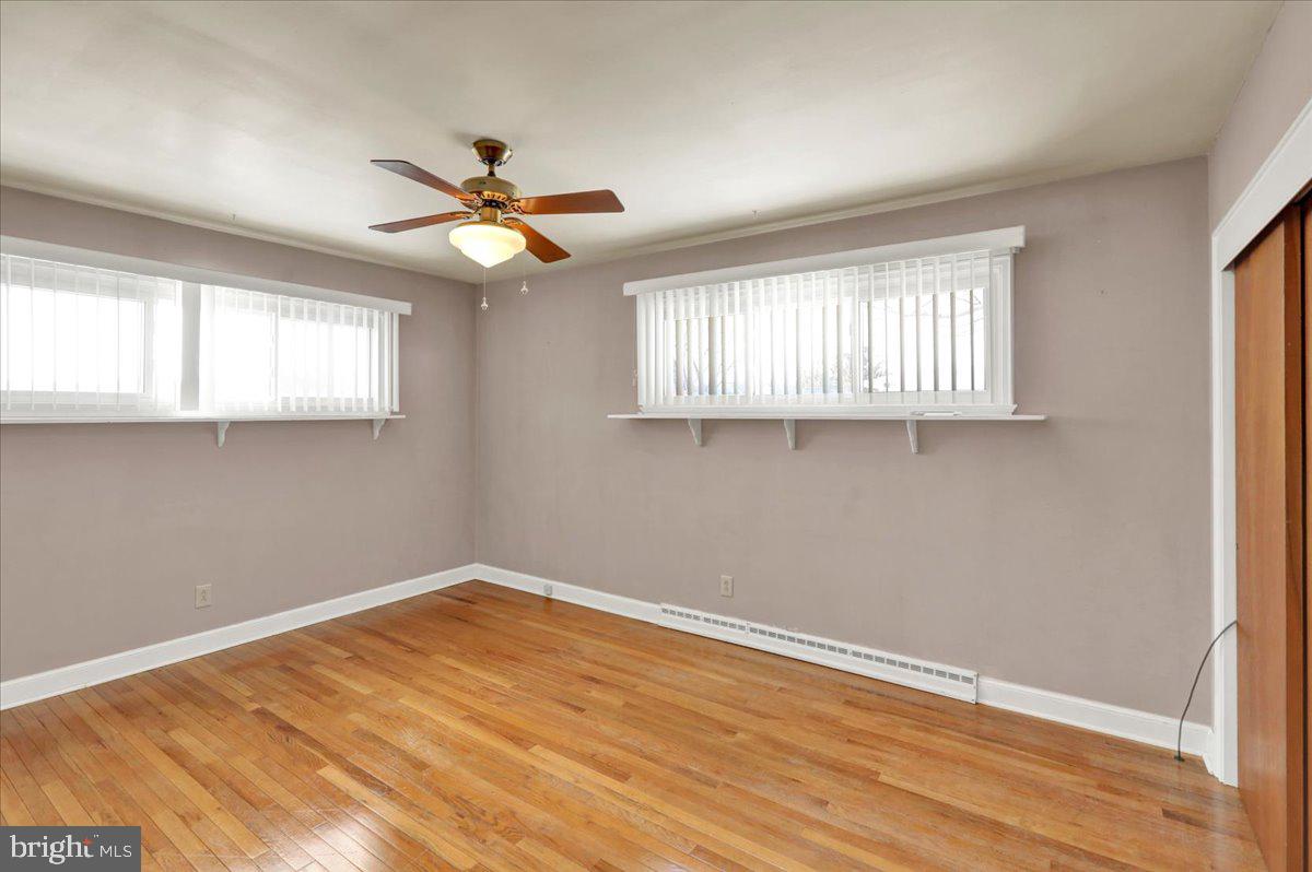 629 Lawrence Avenue Reading, PA 19609 - Photo 17 of 39 a view of empty room with window and wooden floor