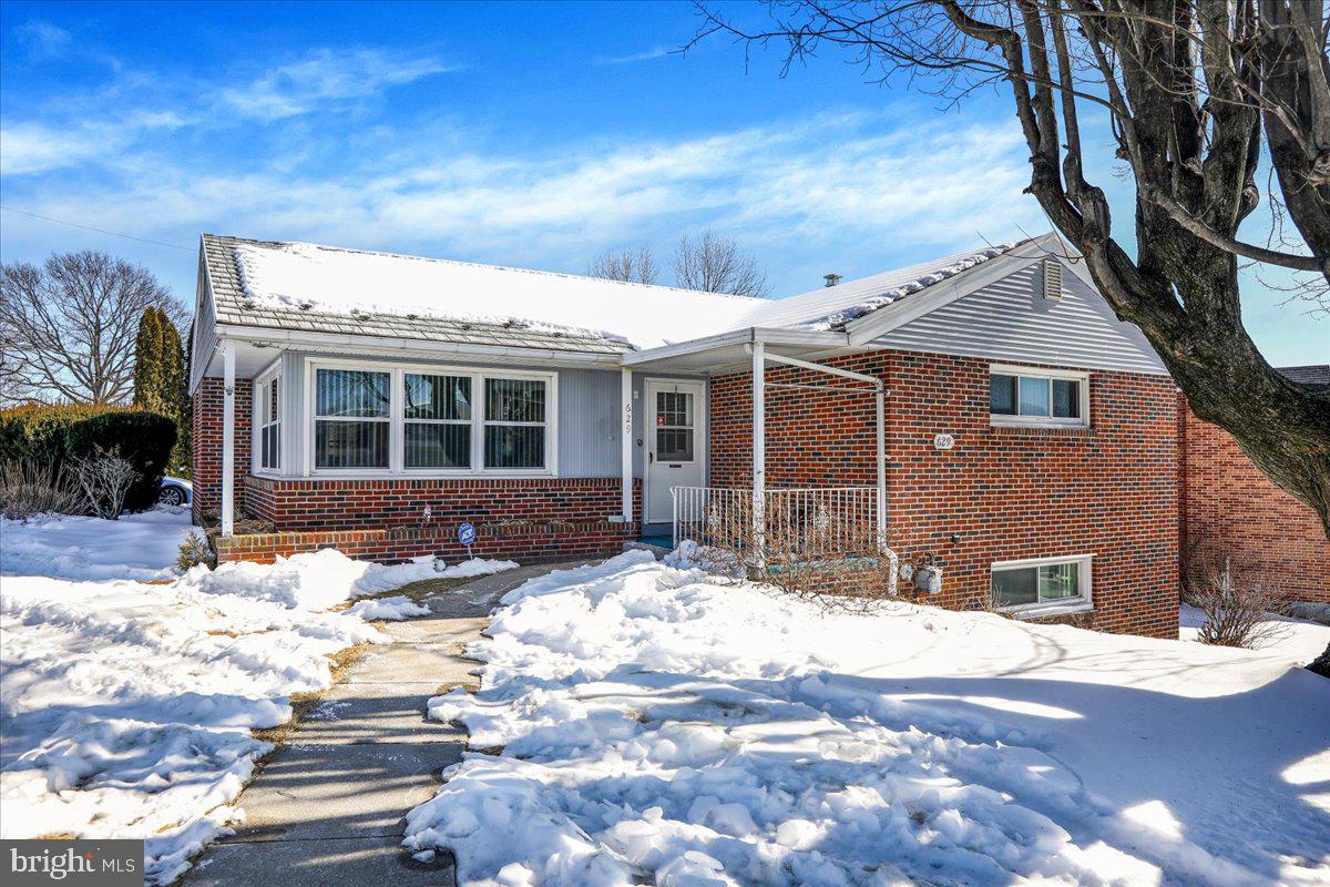 629 Lawrence Avenue Reading, PA 19609 - Photo 3 of 39 a view of a house with snow on the road
