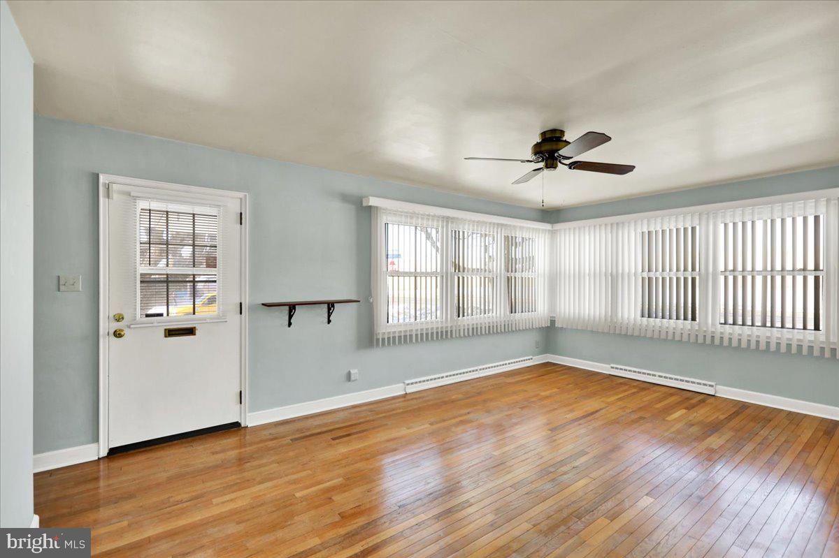 629 Lawrence Avenue Reading, PA 19609 - Photo 5 of 39 a view of empty room with wooden floor and fan