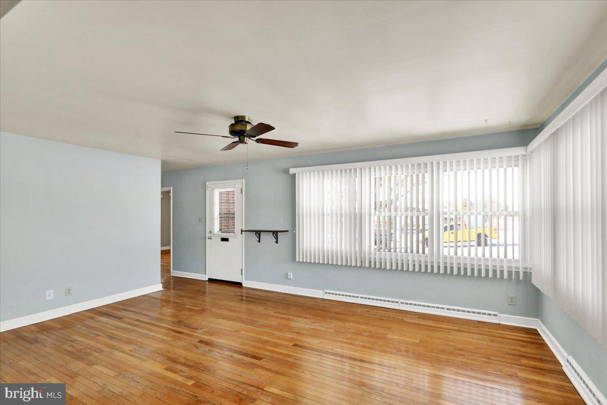 629 Lawrence Avenue Reading, PA 19609 - Photo 6 of 39 wooden floor in an empty room with a window