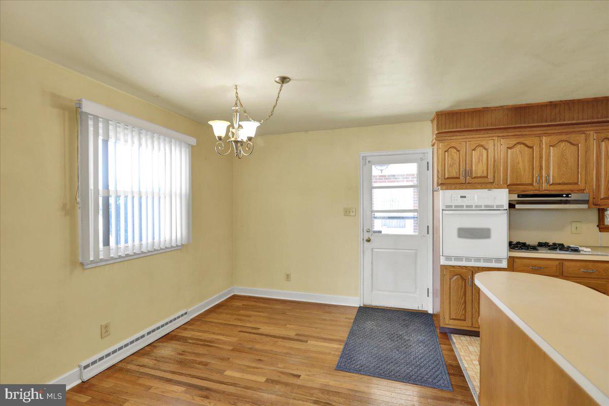 629 Lawrence Avenue Reading, PA 19609 - Photo 8 of 39 a view of a kitchen with a stove cabinets and wooden floor