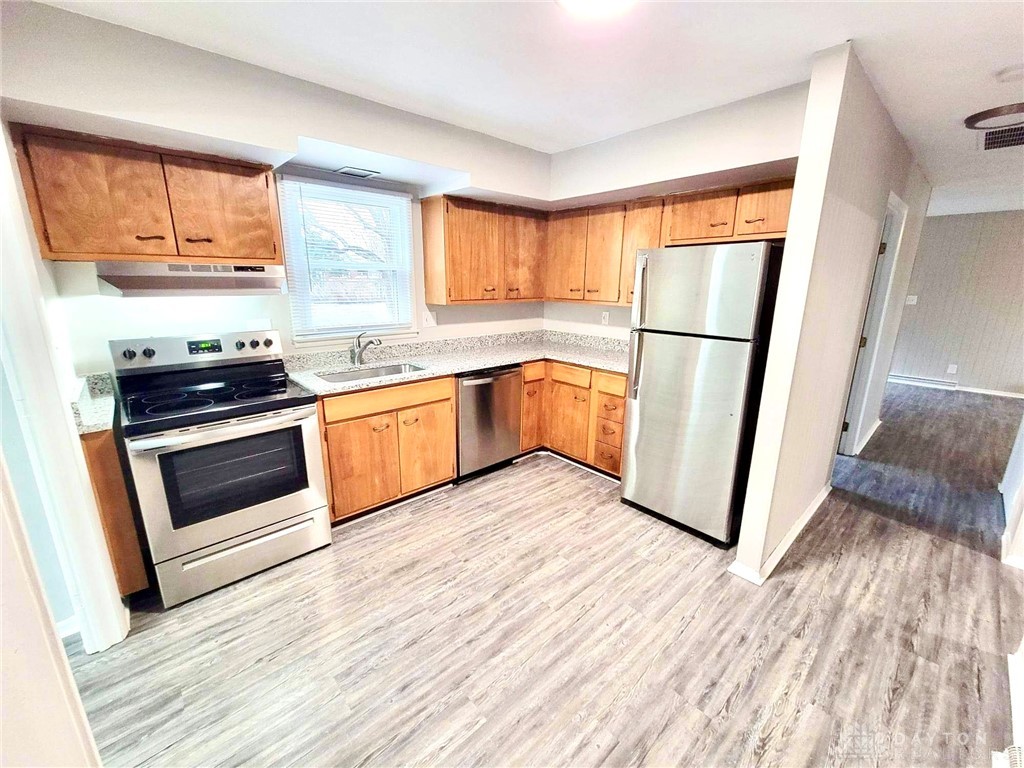1452 Farnham Road Troy, OH 45373 - Photo 2 of 14 Updated kitchen features new stainless steel appliances and sleek granite countertops