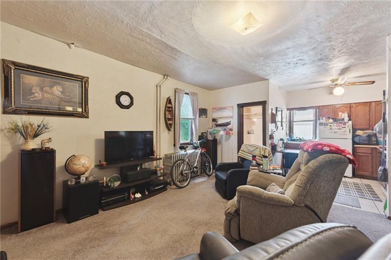 322 North 4th Street Apollo, PA 15613 - Photo 3 of 11 a living room with furniture and a flat screen tv