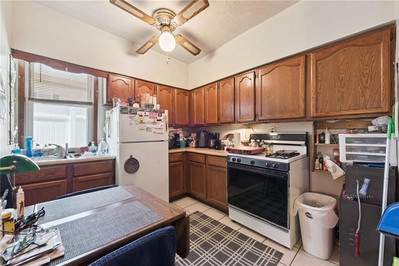 322 North 4th Street Apollo, PA 15613 - Photo 4 of 11 a kitchen with stainless steel appliances granite countertop a stove refrigerator and cabinets