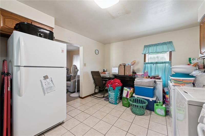 322 North 4th Street Apollo, PA 15613 - Photo 8 of 11 a living room with furniture and a refrigerator