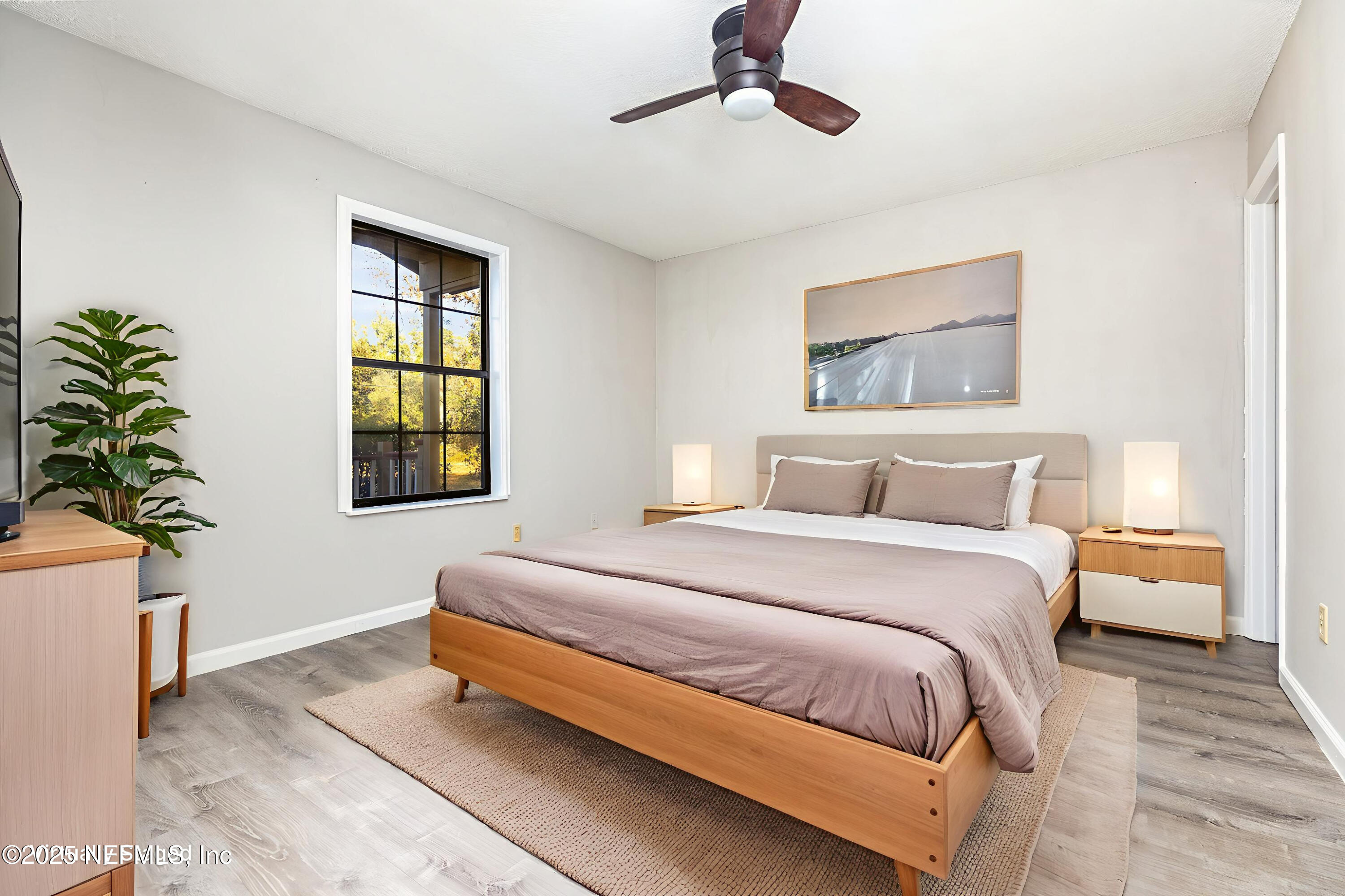 4341 Chokeberry Road Middleburg, FL 32068 - Photo 19 of 38 a bedroom with bed and window