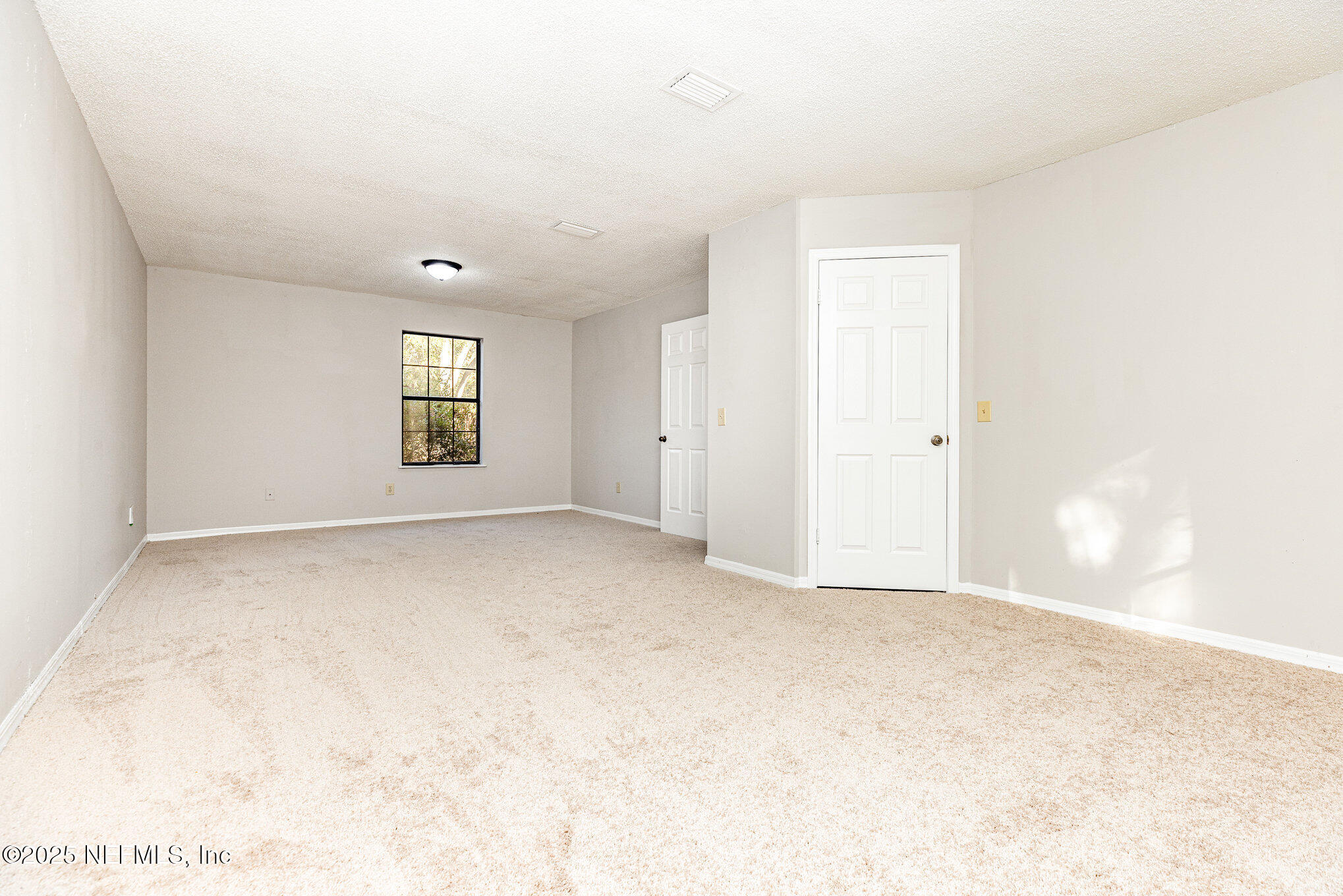 4341 Chokeberry Road Middleburg, FL 32068 - Photo 25 of 38 a view of an empty room with a window