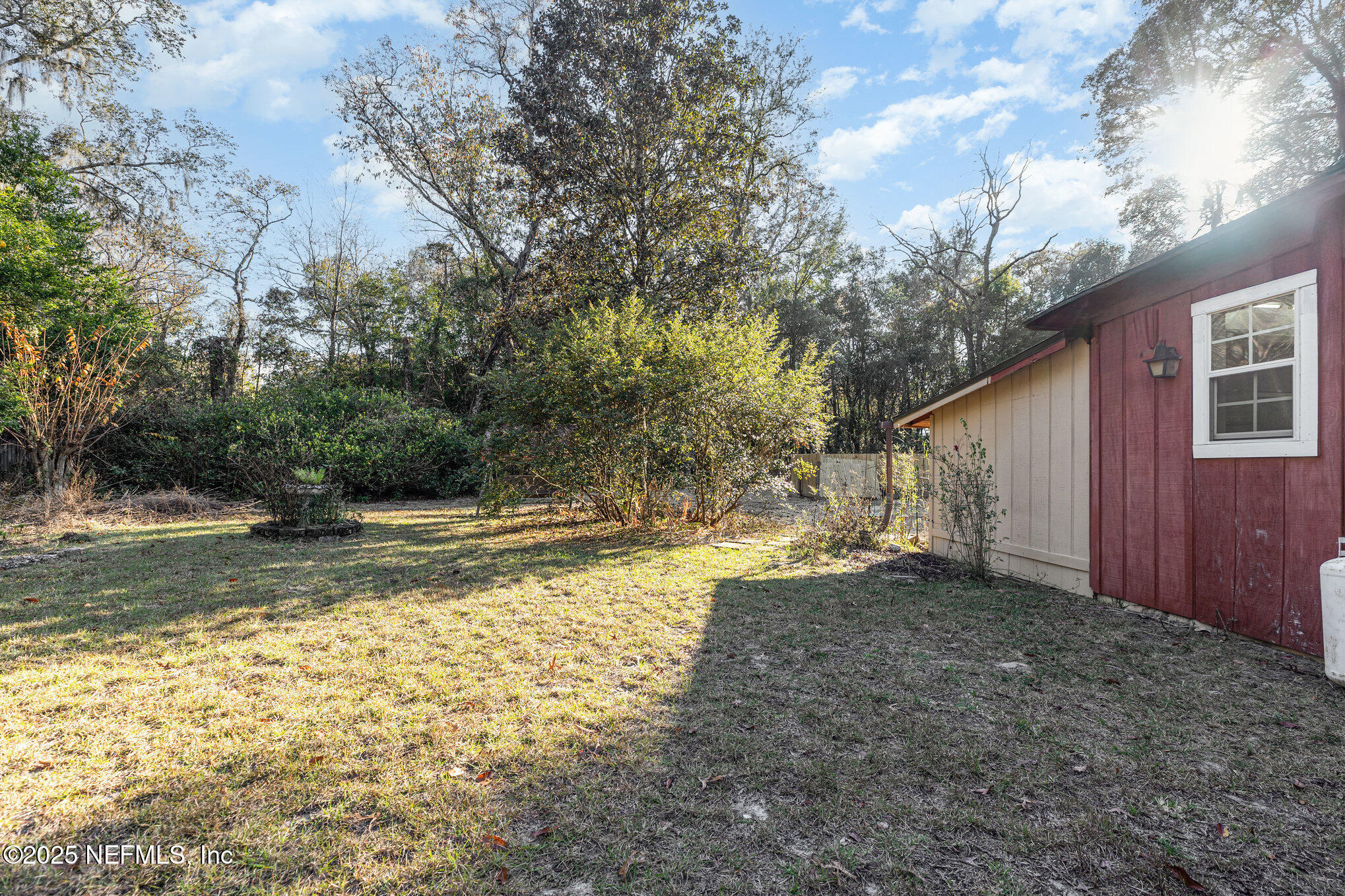4341 Chokeberry Road Middleburg, FL 32068 - Photo 34 of 38 a view of a yard with trees
