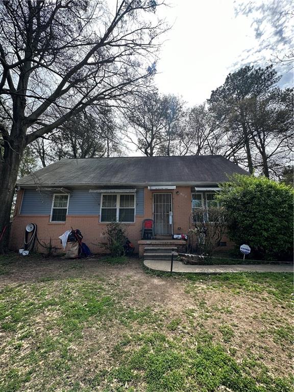 345 Simca Street Southeast Atlanta, GA 30354 - Photo 1 of 1 a view of a house with a yard and a large tree