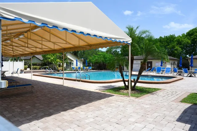 a view of a swimming pool with a patio