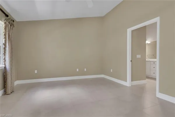 a view of an empty room and window