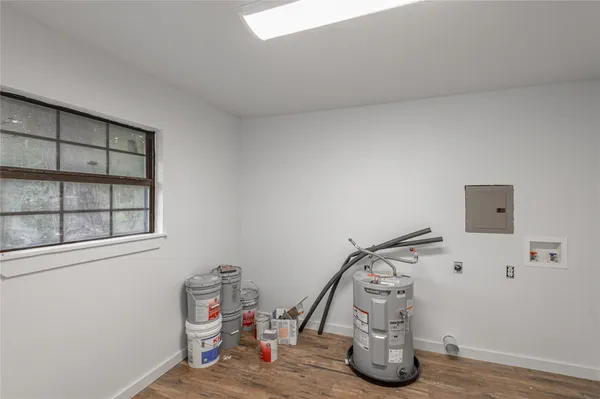 a view of storage and utility room with empty racks