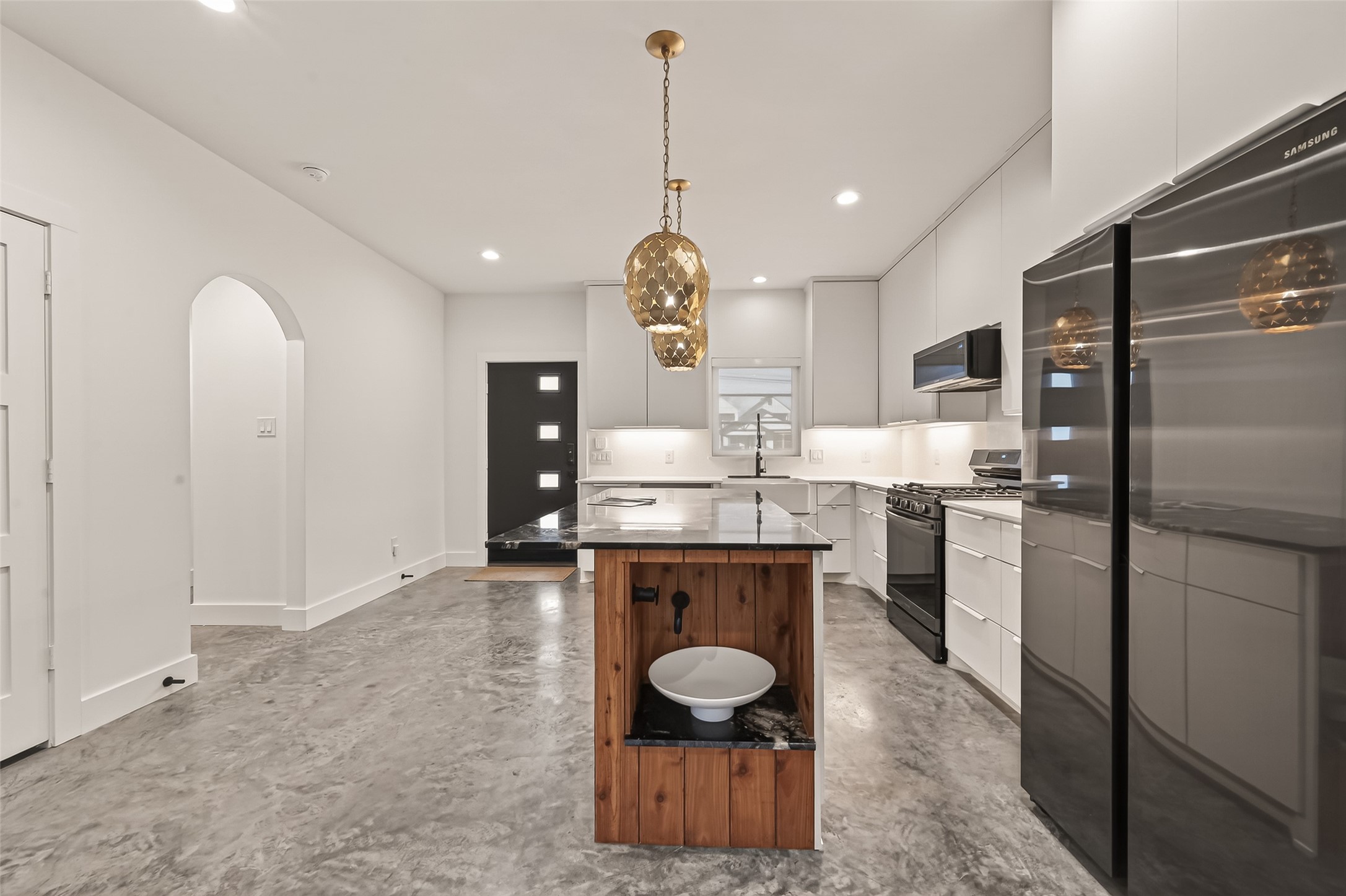 410 East 33rd Street Houston, TX 77018 - Photo 11 of 49 a kitchen with stainless steel appliances granite countertop a sink refrigerator and cabinets