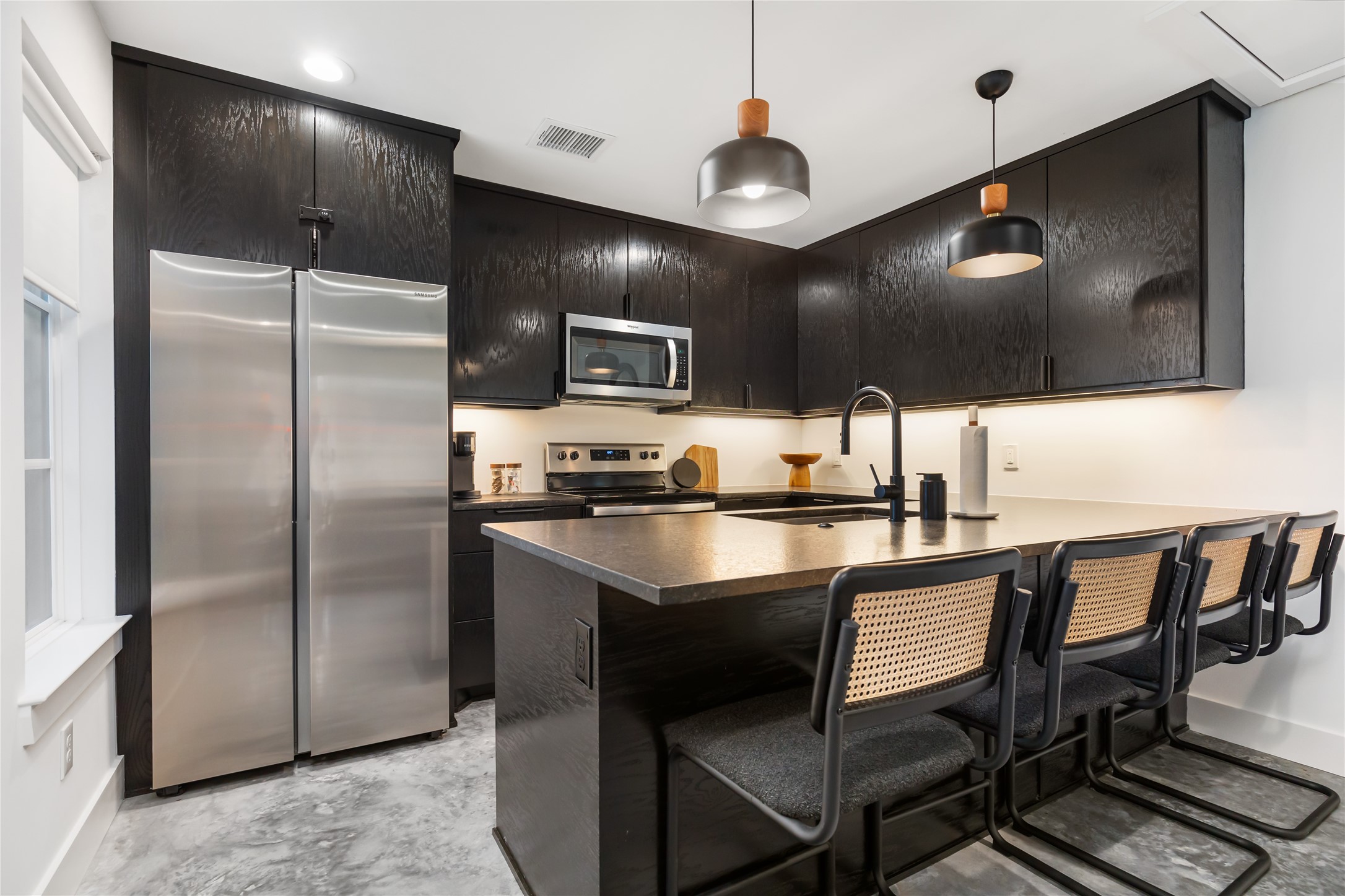 410 East 33rd Street Houston, TX 77018 - Photo 33 of 49 a kitchen with kitchen island a counter space a sink appliances and cabinets