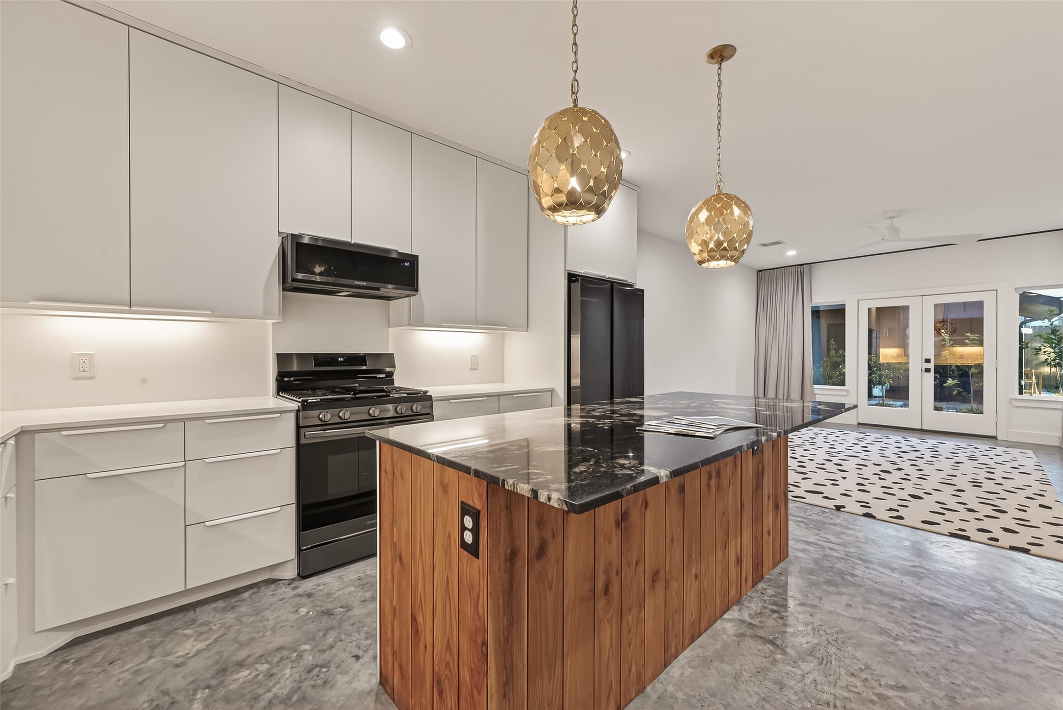 410 East 33rd Street Houston, TX 77018 - Photo 8 of 49 a kitchen with stainless steel appliances granite countertop a sink a stove and a wooden floors