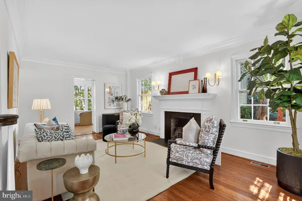 a view of living room with furniture and wooden floor