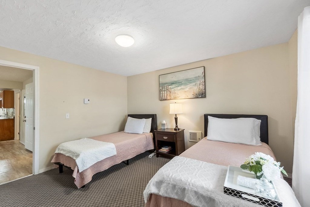 14 Hancock Street Worcester, MA 01610 - Photo 16 of 36 a bedroom with two beds and painting on the wall