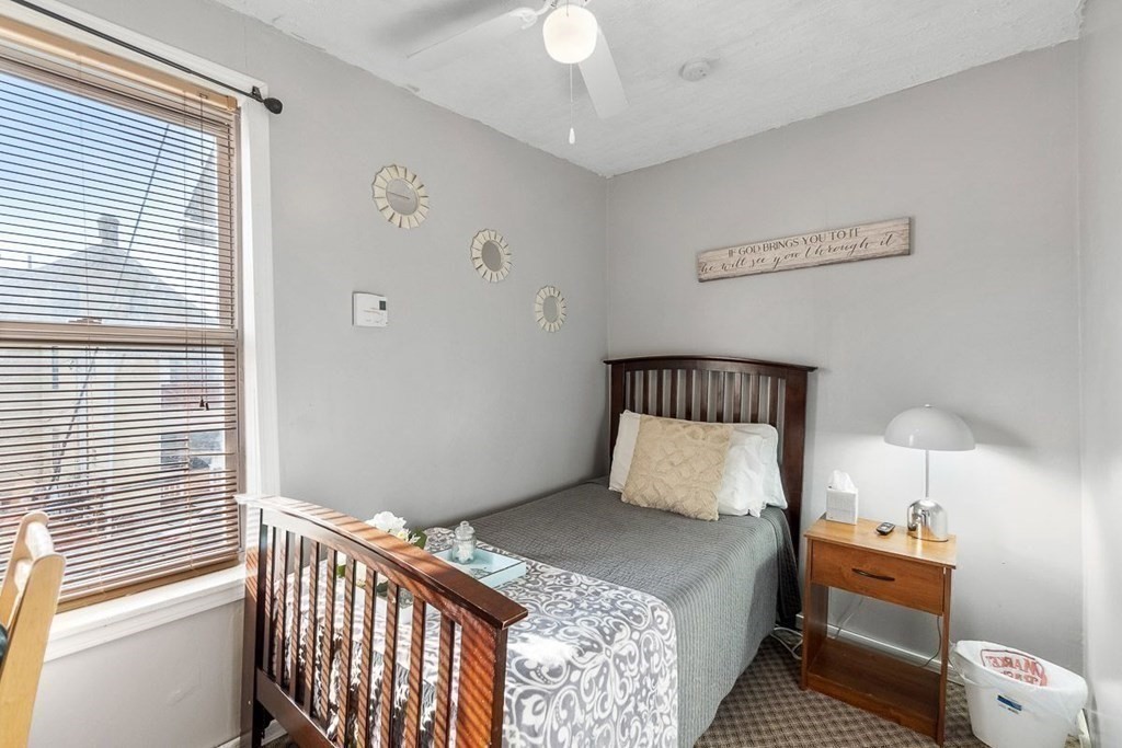 14 Hancock Street Worcester, MA 01610 - Photo 26 of 36 a bedroom with a bed and a window