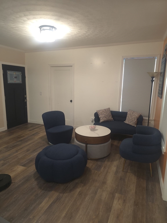14 Hancock Street Worcester, MA 01610 - Photo 29 of 36 a living room with furniture and a wooden floor