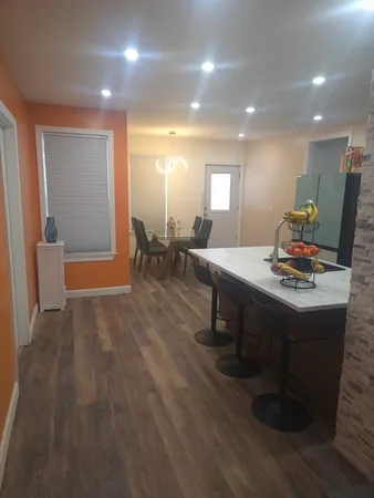 a kitchen with stainless steel appliances a sink stove and refrigerator