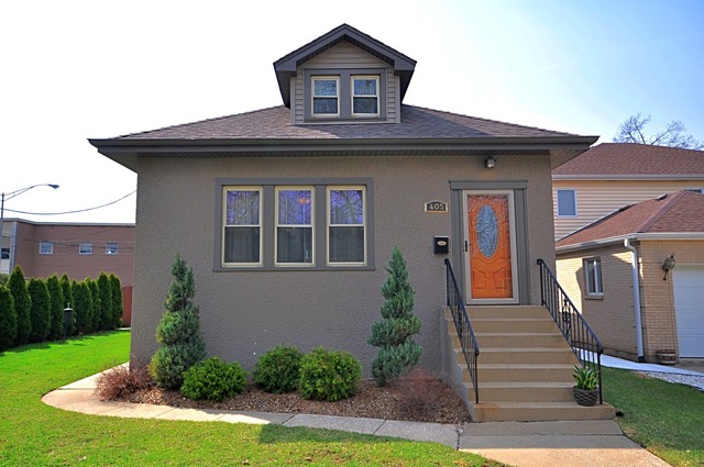 405 Blackhawk Road Riverside, IL 60546 - Photo 1 of 24 a front view of a house with garden