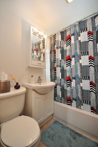 405 Blackhawk Road Riverside, IL 60546 - Photo 14 of 24 a bathroom with a toilet sink and mirror