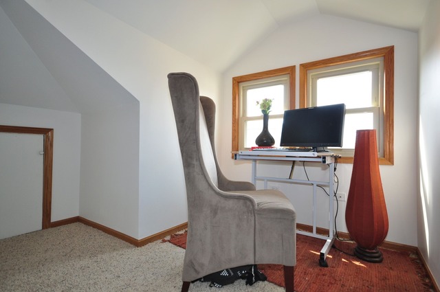 405 Blackhawk Road Riverside, IL 60546 - Photo 15 of 24 a view of a workspace with furniture and a window