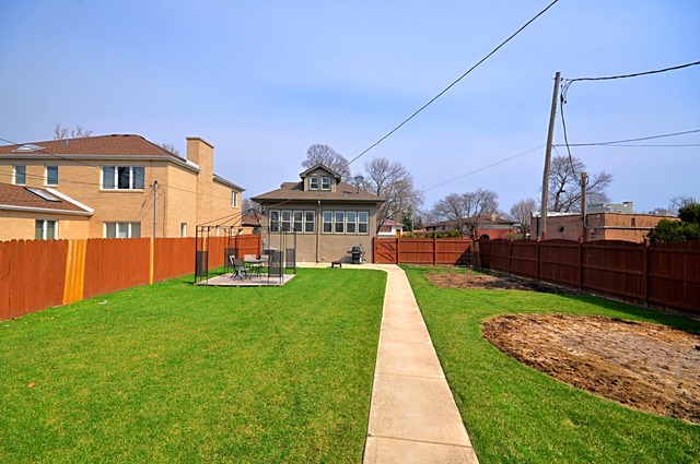 405 Blackhawk Road Riverside, IL 60546 - Photo 18 of 24 a view of a house with a yard