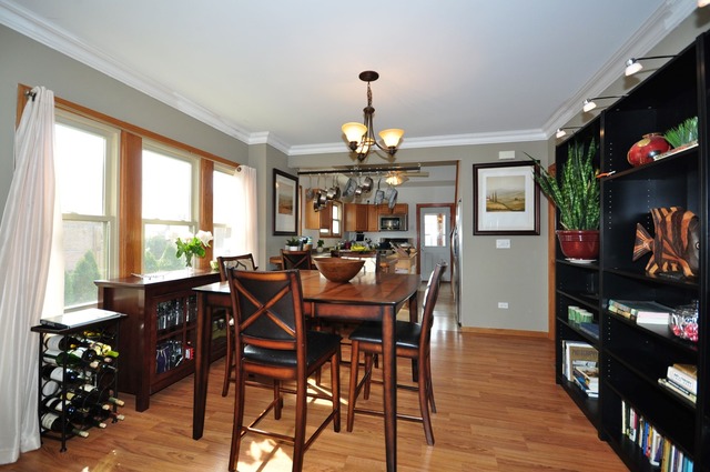 405 Blackhawk Road Riverside, IL 60546 - Photo 4 of 24 a view of a dining room with furniture window and wooden floor