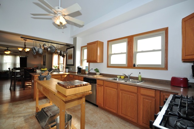 405 Blackhawk Road Riverside, IL 60546 - Photo 7 of 24 a kitchen with a sink stove and cabinets