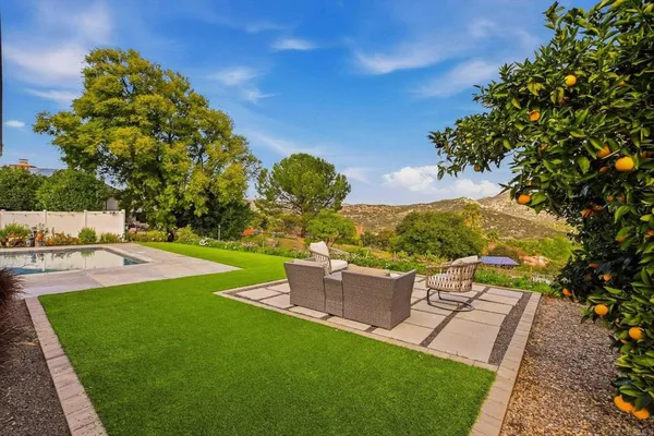 a view of a garden with a building in the background