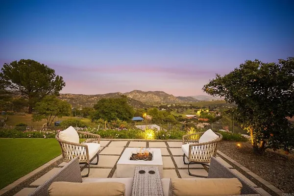 a view of a chairs and table on the terrace