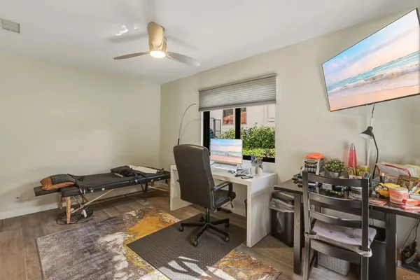 a view of a workspace with furniture and a workspace