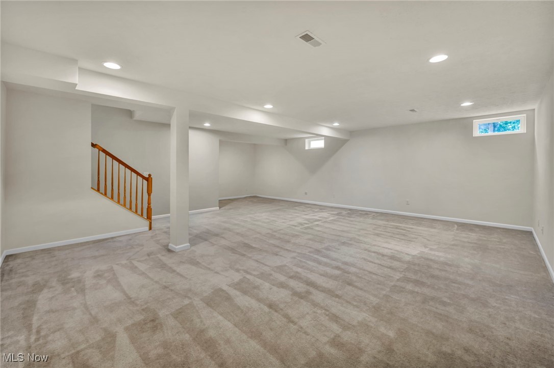 143 Stone Ridge Way Berea, OH 44017 - Photo 21 of 47 Below grade area with recessed lighting, carpet flooring, stairs, and healthy amount of natural light