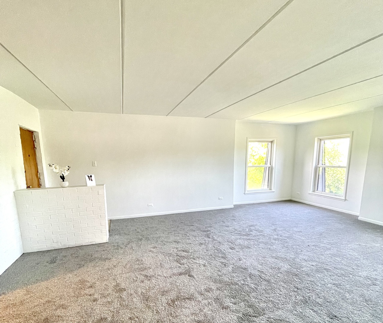 2610 Oakton Street, Unit 9W Park Ridge, IL 60068 - Photo 3 of 14 a view of a room with window and a ceiling fan