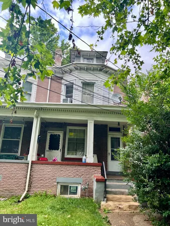a front view of a house with a garage