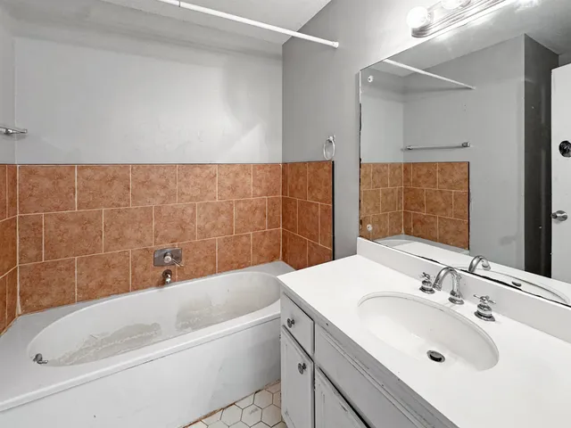a bathroom with a sink and a bathtub
